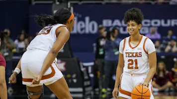 Gisella Maul #21 and Aaliyah Moore #23 of the Texas Longhorns celebrate as we offer our Gonzaga vs. Texas prediction and pick for the Sweet 16 of the women's NCAA Tournament on Friday.
