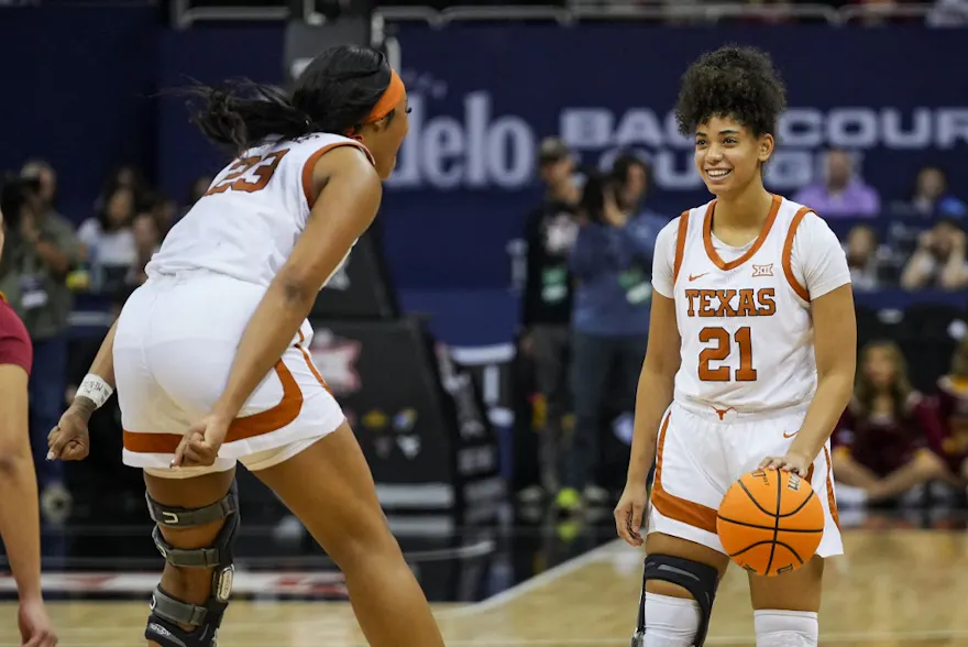 Gisella Maul #21 and Aaliyah Moore #23 of the Texas Longhorns celebrate as we offer our Gonzaga vs. Texas prediction and pick for the Sweet 16 of the women's NCAA Tournament on Friday.