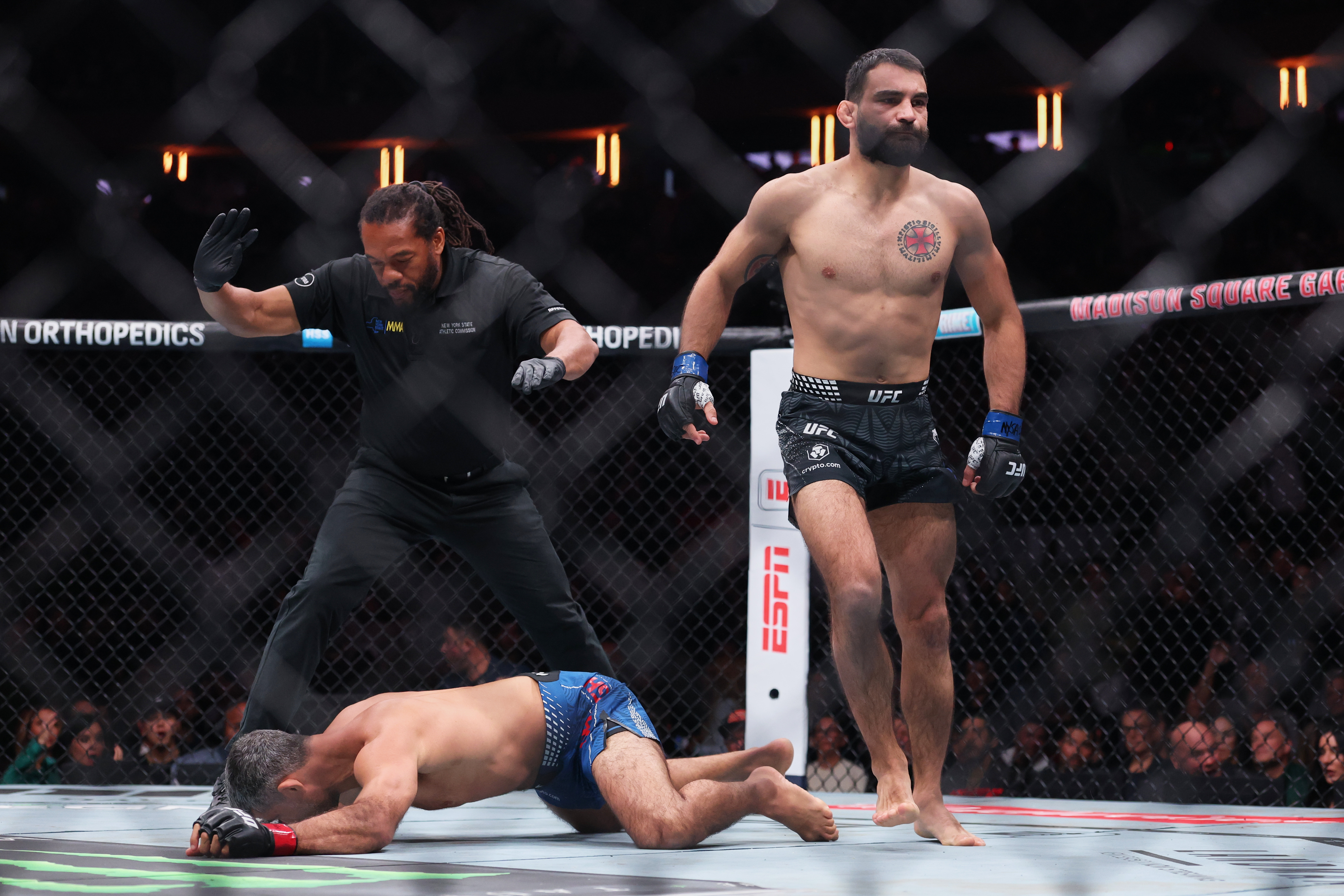 Benoit Saint Denis (blue gloves) reacts after a win as we break down our Dan Hooker vs. Benoit Saint Denis.