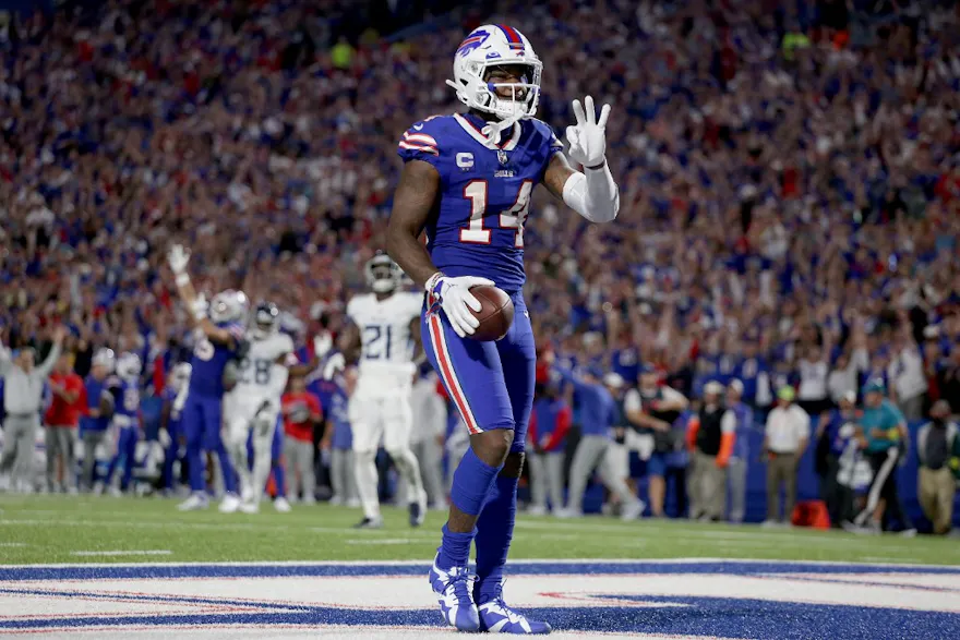 Stefon Diggs #14 of the Buffalo Bills celebrates after scoring his third touchdown of the night against the Tennessee Titans during the third quarter of the game at Highmark Stadium on September 19, 2022 in Orchard Park, New York.