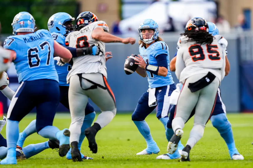 Toronto Argonauts quarterback Cameron Dukes looks to make a pass against the BC Lions at BMO Field. We expect the Over to hit in our Alouettes vs. Argonauts prediction.