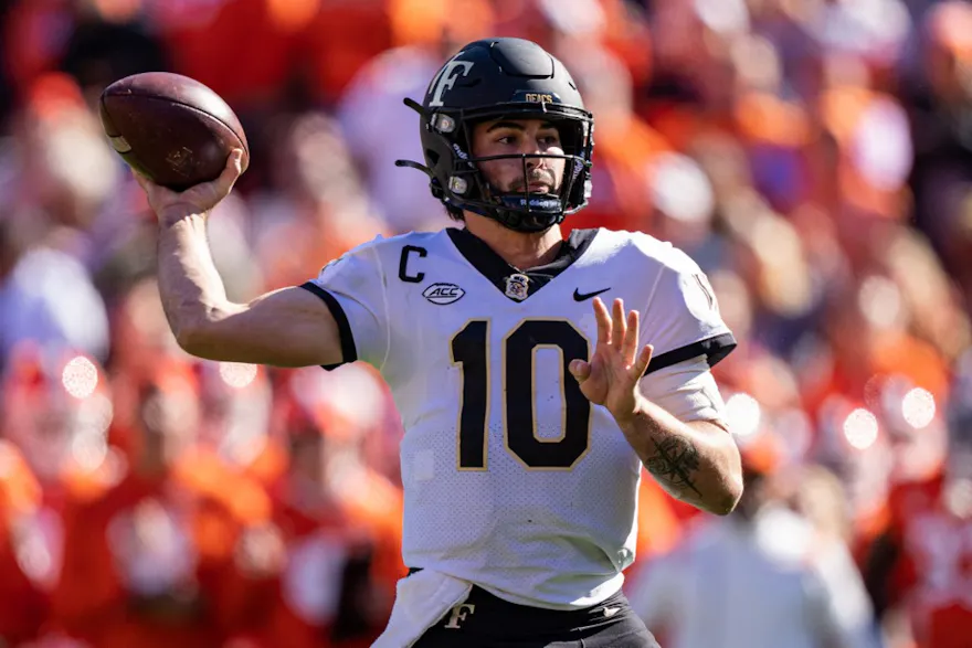 Quarterback Sam Hartman of the Wake Forest Demon Deacons passes the ball against the Clemson Tigers in the second quarter during their game at Clemson Memorial Stadium.