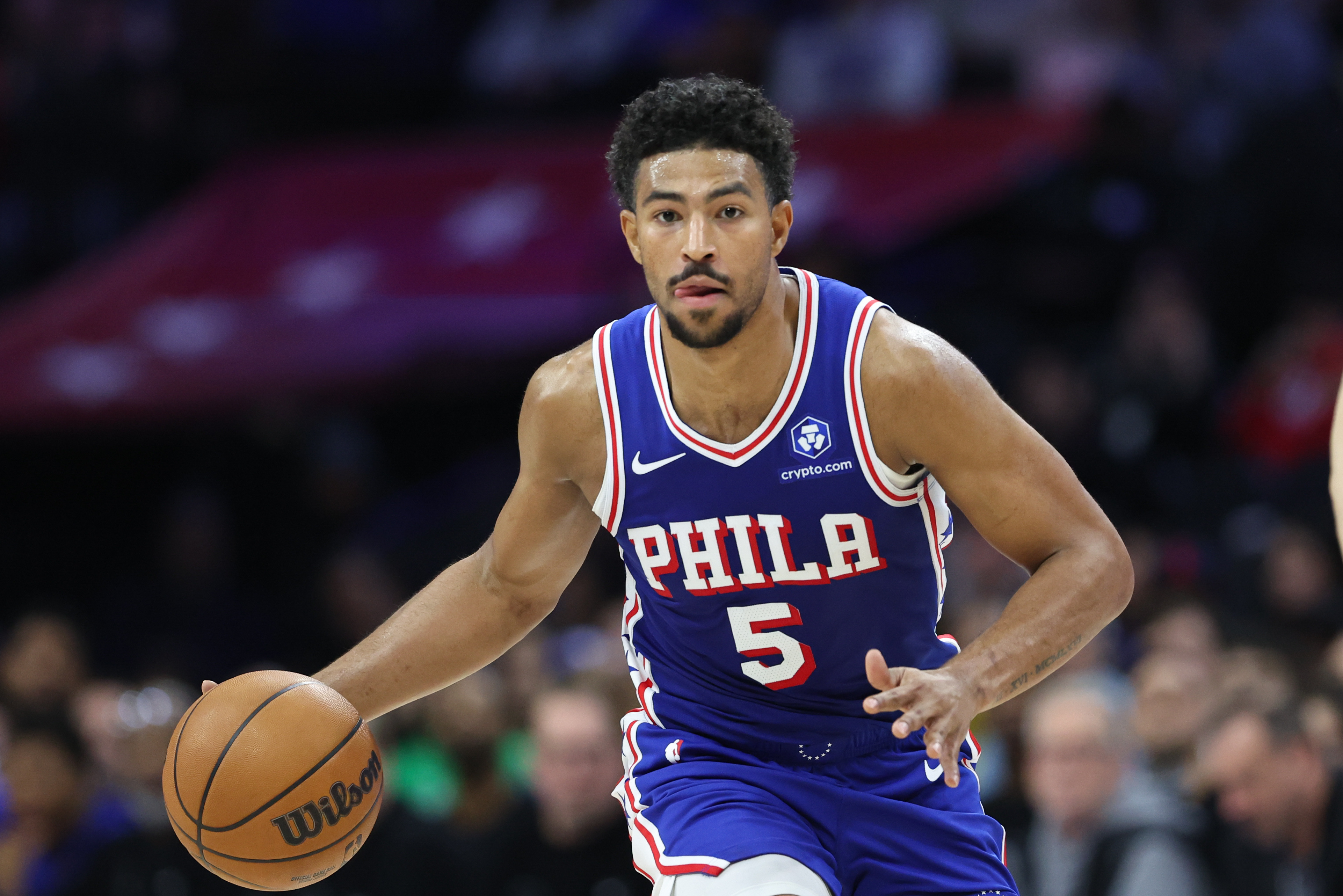 Philadelphia 76ers guard Quentin Grimes (5), seen here dribbling during a game, is featured in our NBA player props today.