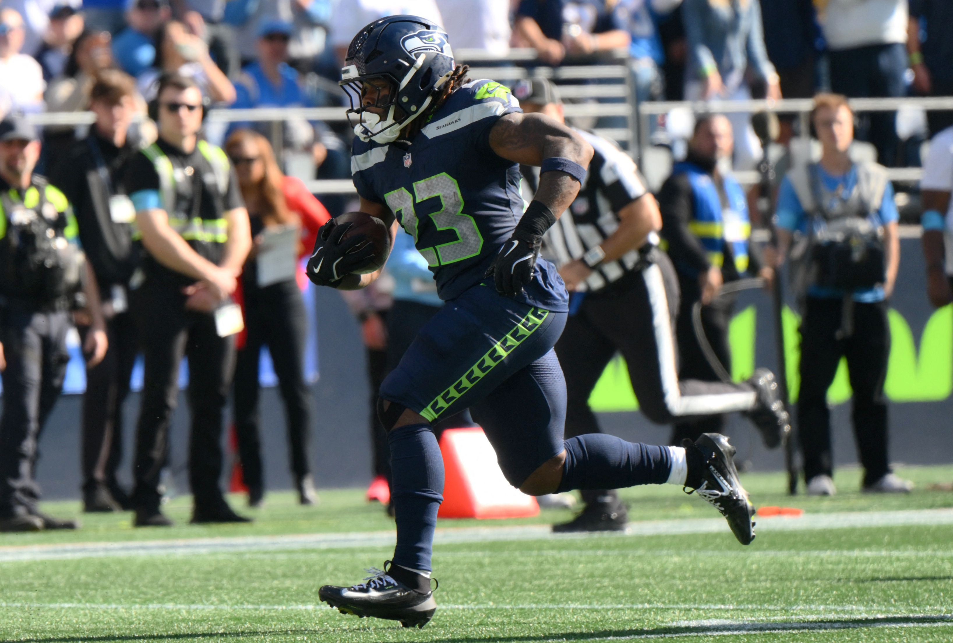 Seattle Seahawks running back Emanuel Wilson (23) runs for a touchdown as he is featured in our Seahawks vs. Broncos player props.