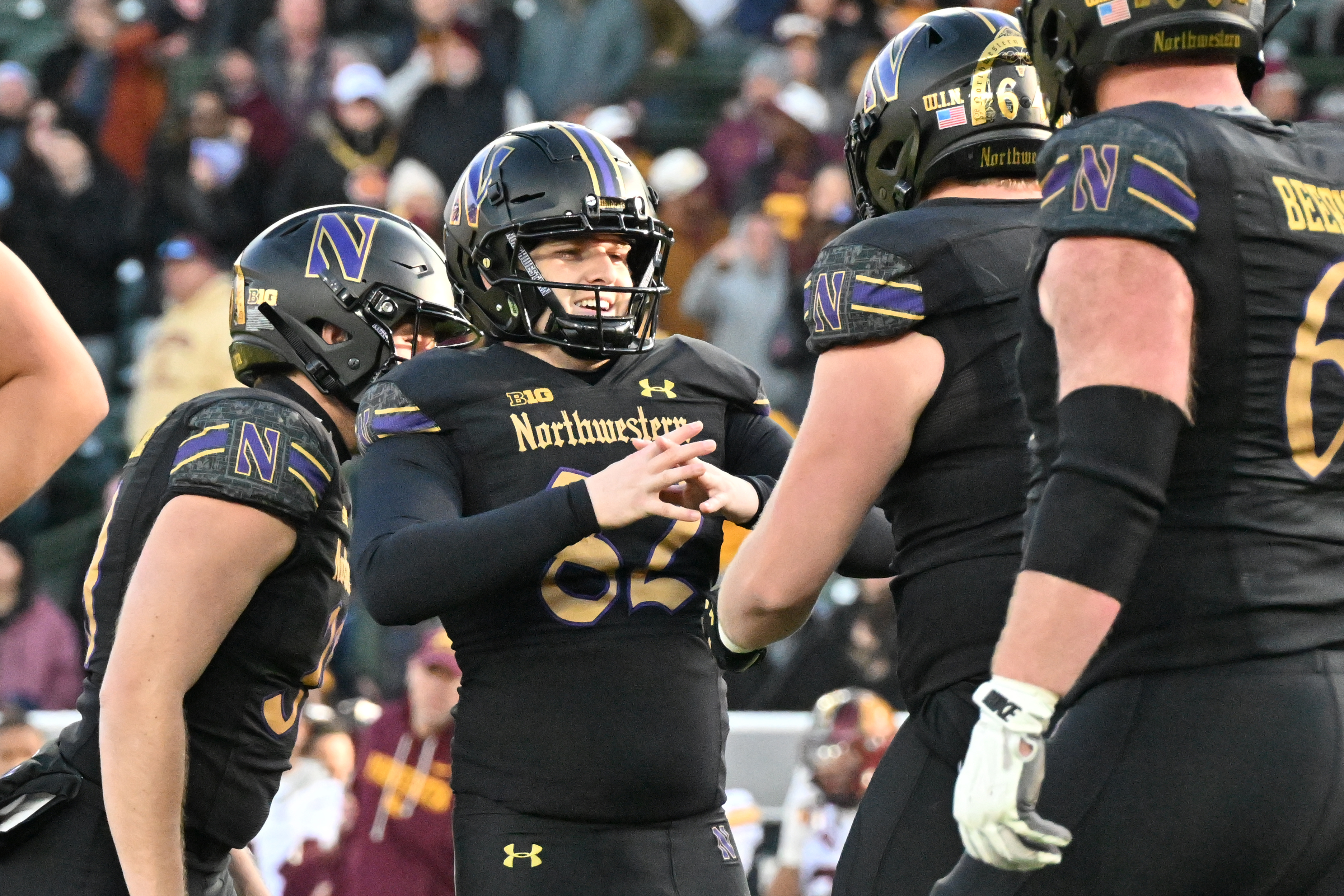 Northwestern kicker Jack Olsen (82) celebrates the game-winning field goal with his teammates as we look at the college football bowl game odds