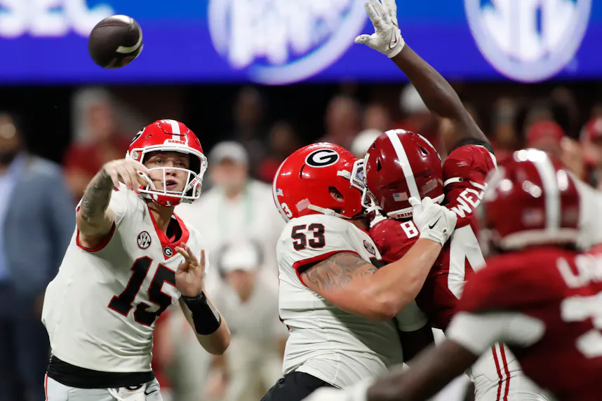 Georgia quarterback Carson Beck throws a pass during the SEC Championship game against Alabama. Georgia and Alabama are both expected to qualify for the expanded College Football Playoff.