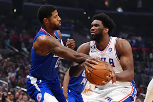Philadelphia 76ers center Joel Embiid (21) is fouled by LA Clippers guard Paul George (13) as we examine the latest NBA championship odds with the Boston Celtics the favorites over the Philadelphia 76ers.
