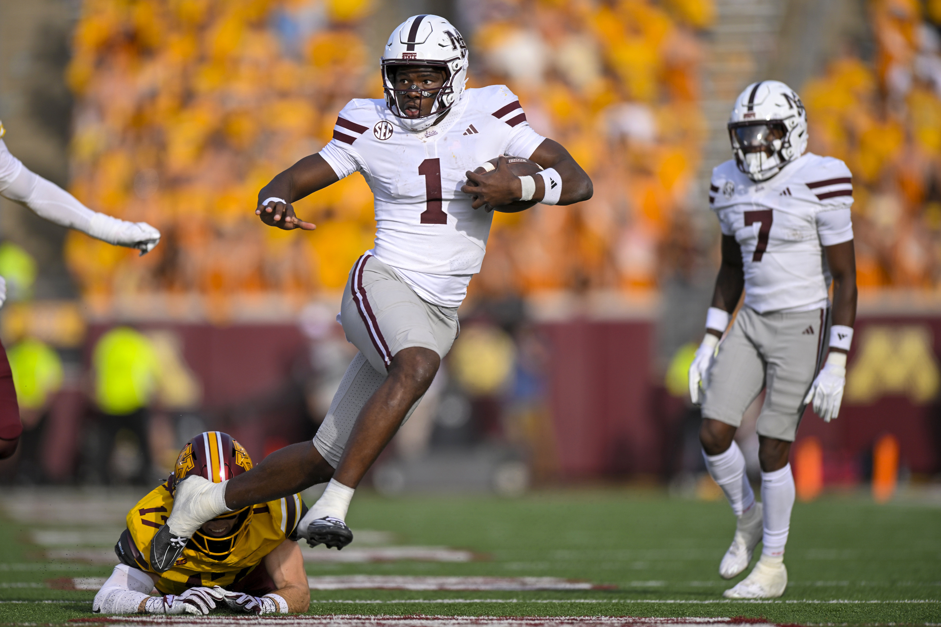 Mississippi State Bulldogs quarterback Kamario Taylor (1) breaks the tackle as he is featured in our Mississippi State vs. South Carolina prediction.