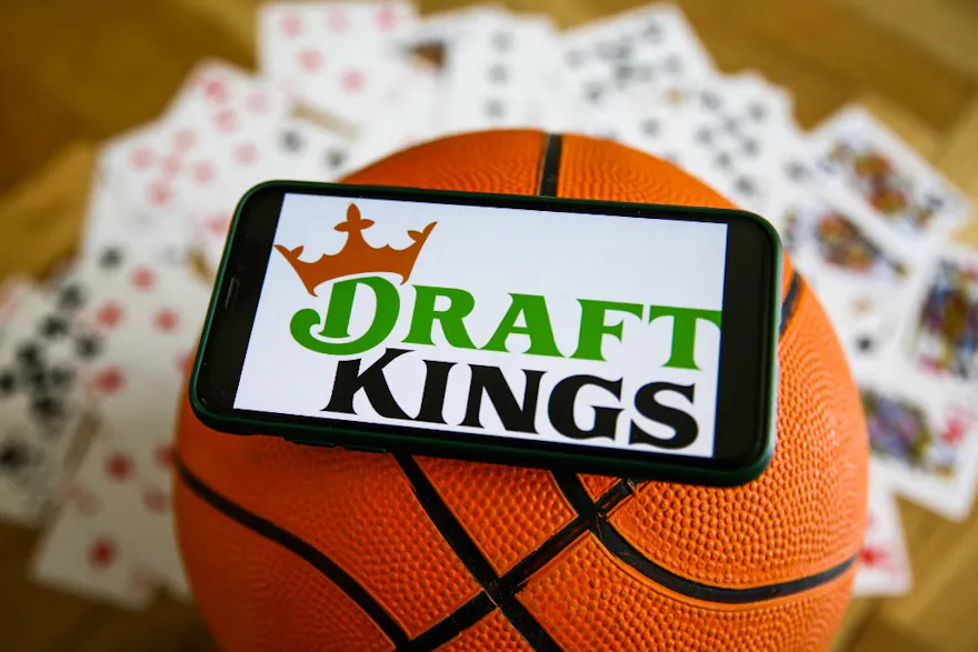 A DraftKings logo on a photo on top of a basketball as we look at our DraftKings pre-launch promo code for Vermont.