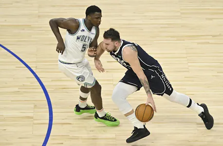 Anthony Edwards of the Minnesota Timberwolves defends against Luka Doncic of the Dallas Mavericks during Game 1 of the Western Conference Finals. We're backing Doncic in our Mavericks vs. Timberwolves Player Props. 