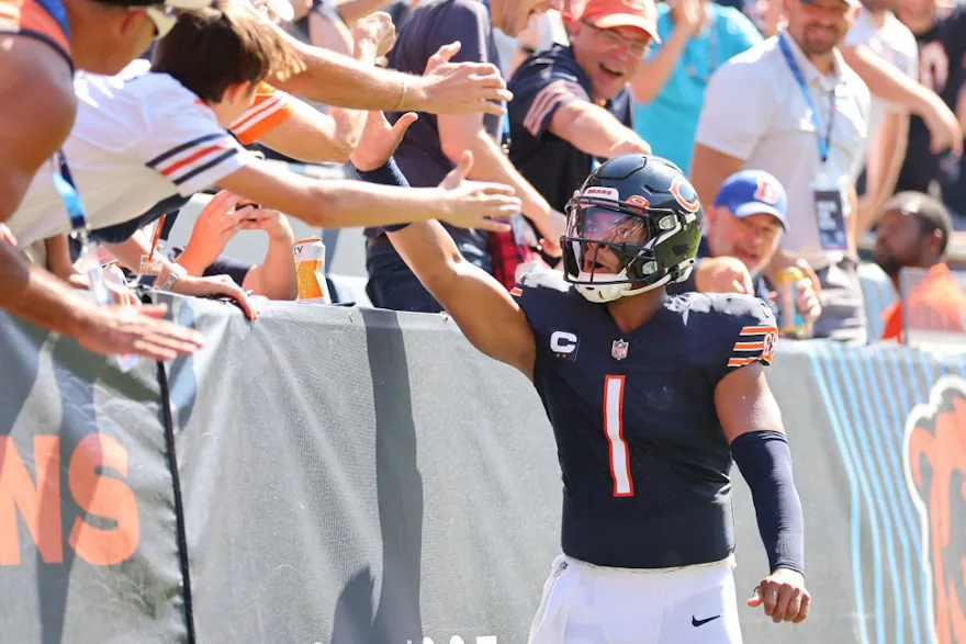 Justin Fields of the Chicago Bears celebrates with fans after a second-quarter touchdown against the Denver Broncos as we look at the Illinois August report.