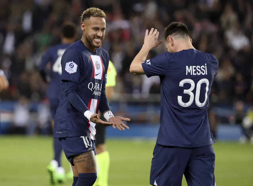 Paris Saint-Germain forward Lionel Messi celebrates with teammate Neymar during the French championship Ligue 1 football match between PSG and Nice on October 1, 2022 at Parc des Princes stadium in Paris, France.