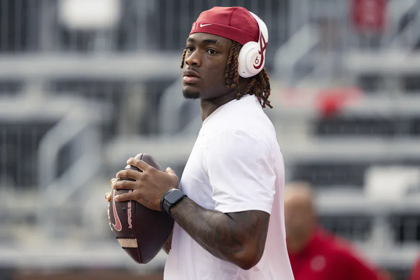 Alabama Crimson Tide quarterback Jalen Milroe throws a pass during warmups prior to the game against the Wisconsin Badgers.