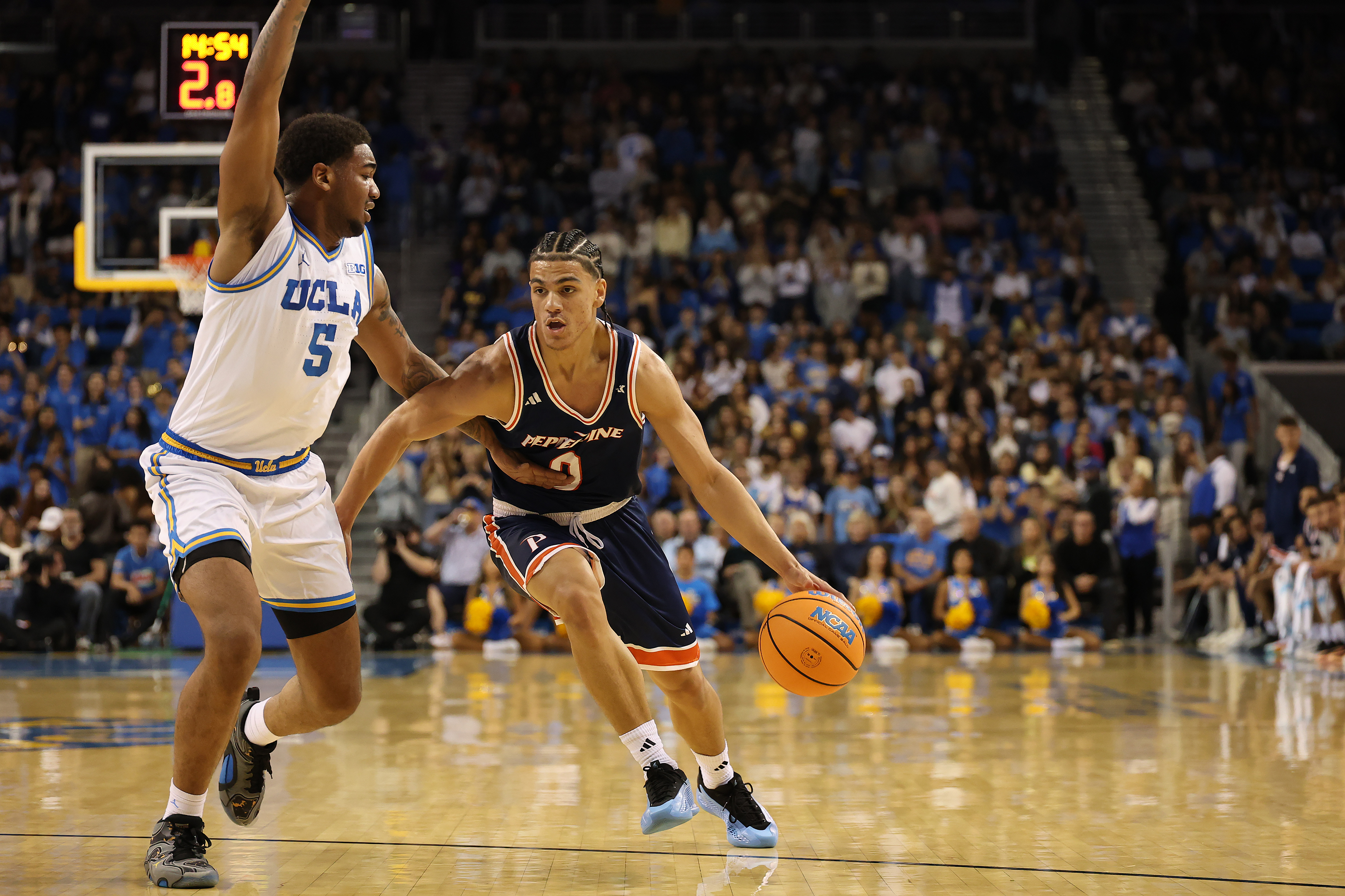 Pepperdine Waves guard Styles Phipps dribbles the ball as we make our college basketball best bets & player props.