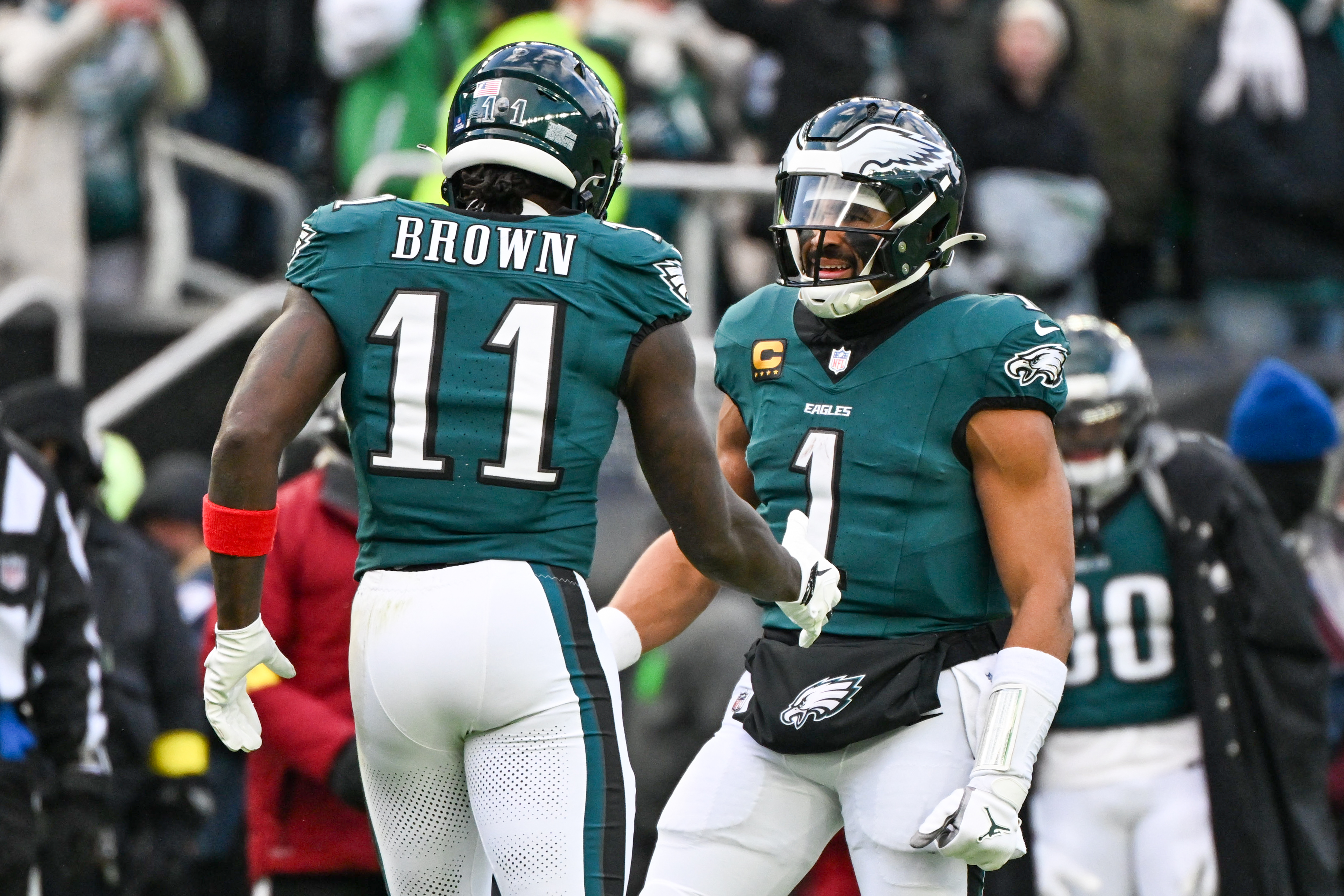  Philadelphia Eagles wide receiver A.J. Brown - who's featured in my Eagles vs. Commanders prediction - and quarterback Jalen Hurts celebrate.