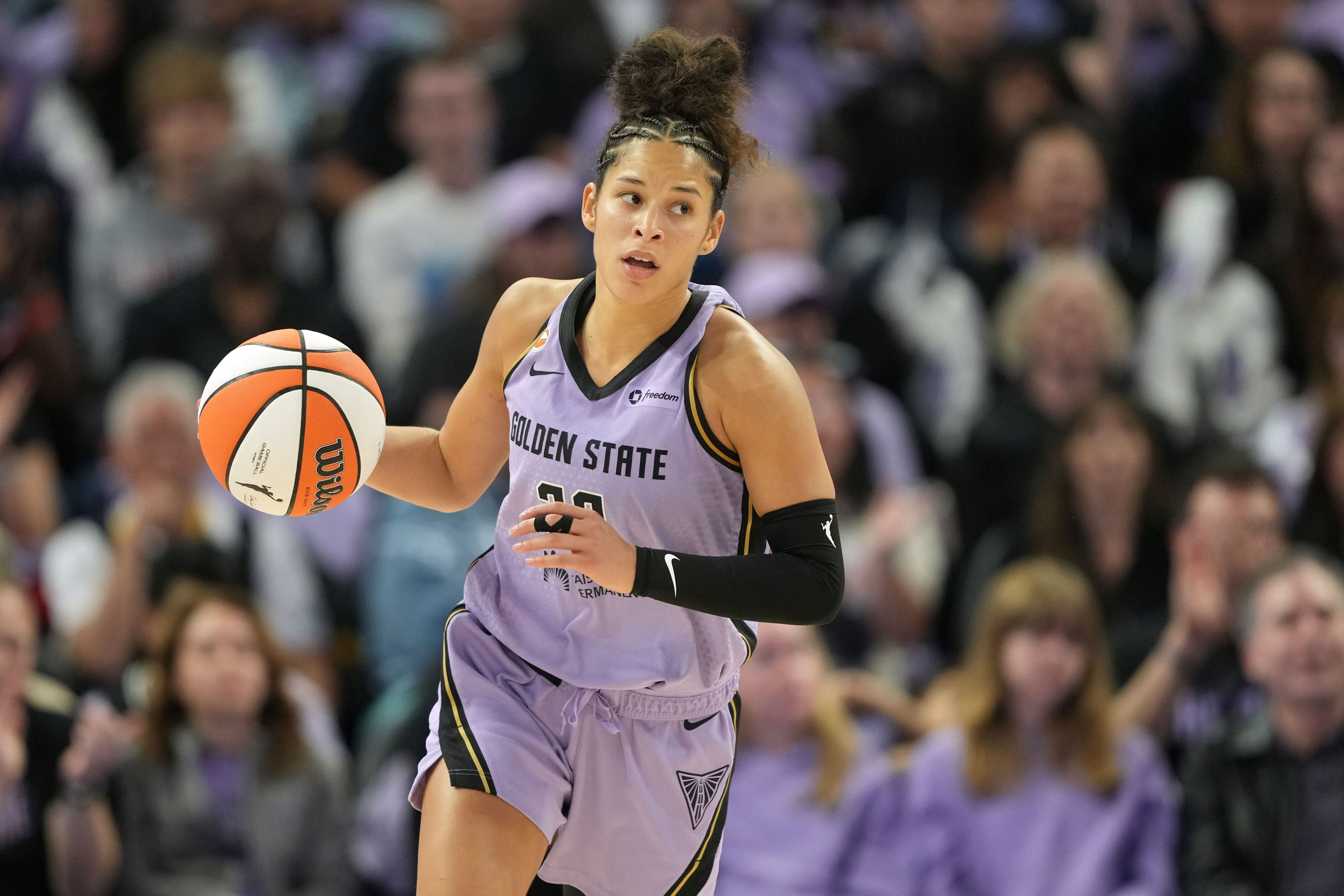 Golden State Valkyries guard Veronica Burton (22), seen here controlling the ball during a game, is featured in our Sun vs. Valkyries prediction tonight.