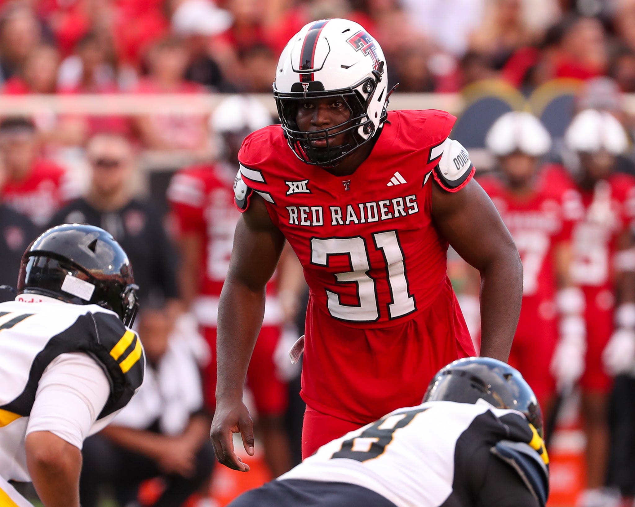Texas Tech's David Bailey prepares to rush the Arkansas-Pine Bluff offense during a non-conference football game. He's projected to be the No. 2 pick across NFL mock draft expert consensus picks.