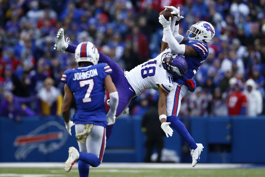 Justin Jefferson of the Minnesota Vikings catches a pass in front of Cam Lewis of the Buffalo Bills during the fourth quarter at Highmark Stadium on November 13, 2022 in Orchard Park, New York.