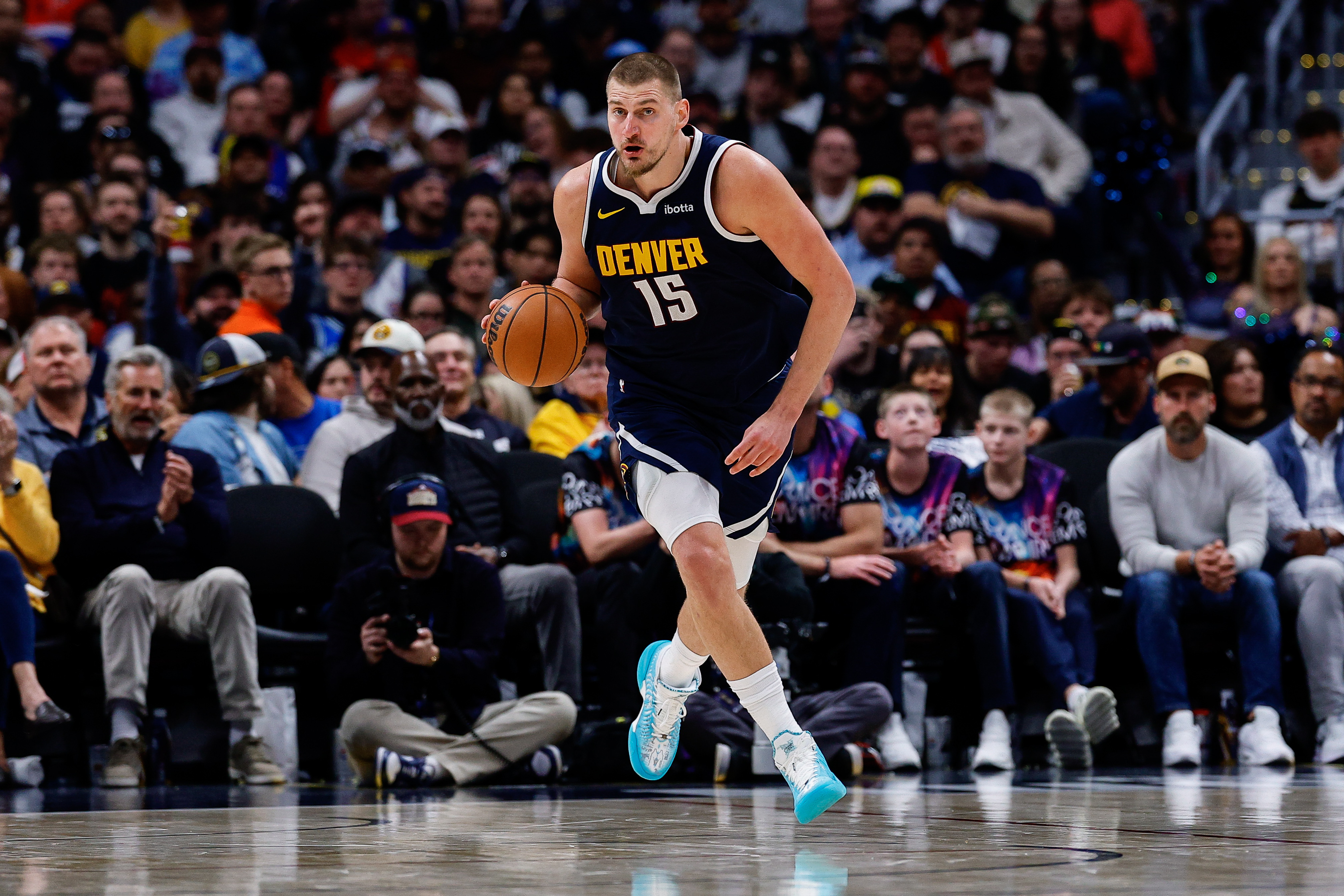 Denver Nuggets center Nikola Jokic (15) dribbles the ball up court as we break down our NBA Play of the Day.