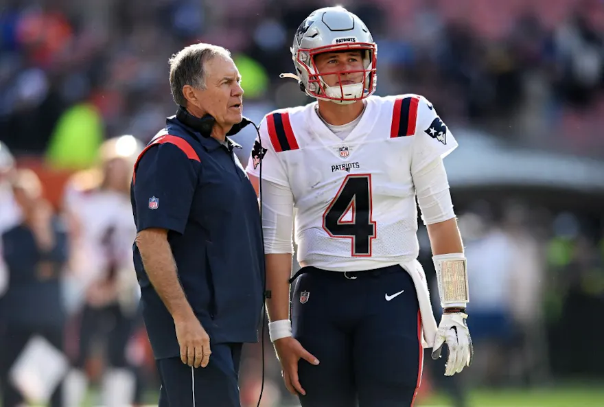 Head coach Bill Belichick of the New England Patriots talks to Bailey Zappe during the fourth quarter against the Cleveland Browns, and we offer our top Patriots vs. Broncos prediction based on the best NFL odds.
