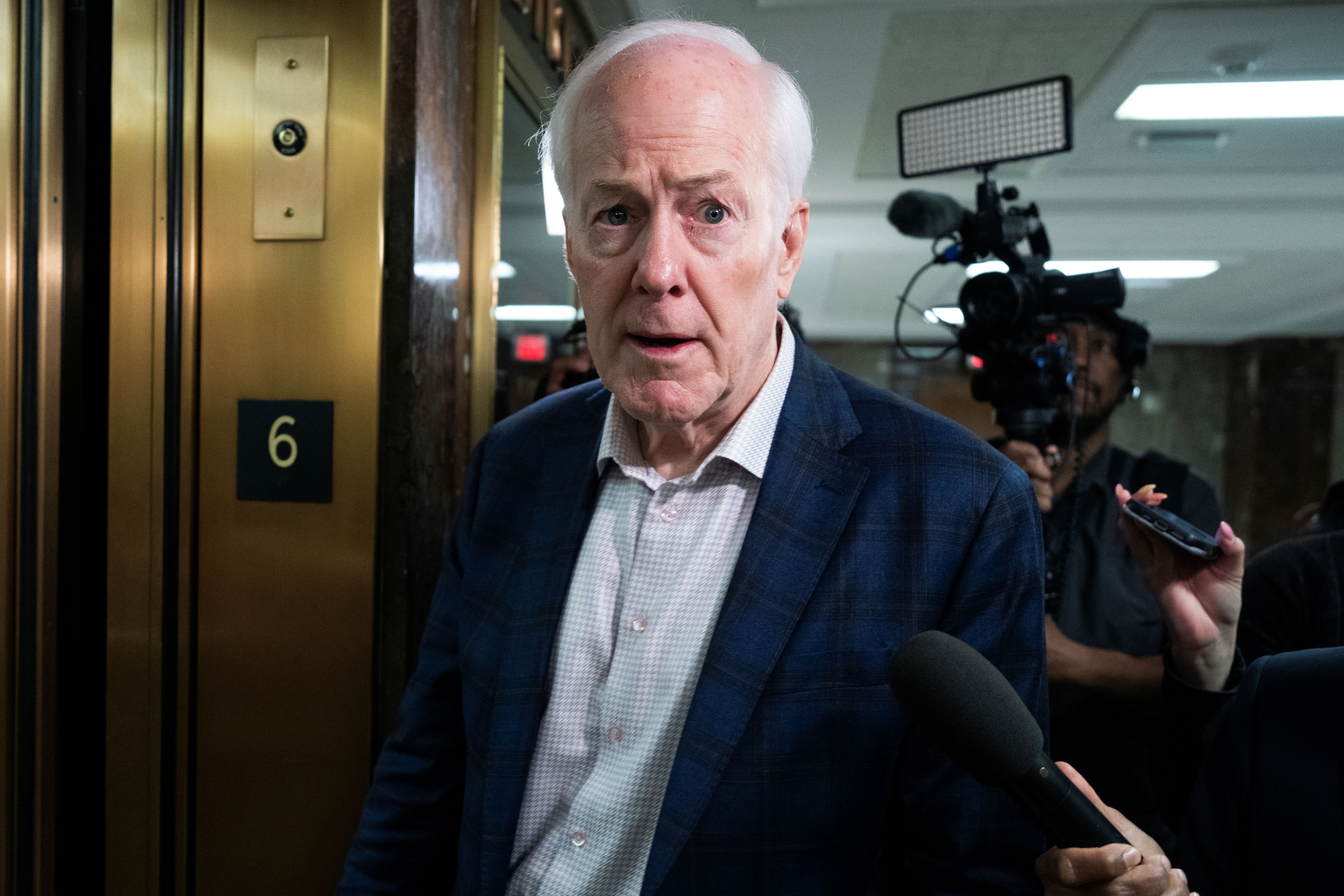 Sen. John Cornyn, R-Texas, talks with reporters, and he's featured in the Texas Senate odds.