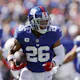 Saquon Barkley of the New York Giants carries the ball against the Atlanta Falcons at MetLife Stadium on Sept. 26, 2021 in East Rutherford, New Jersey.