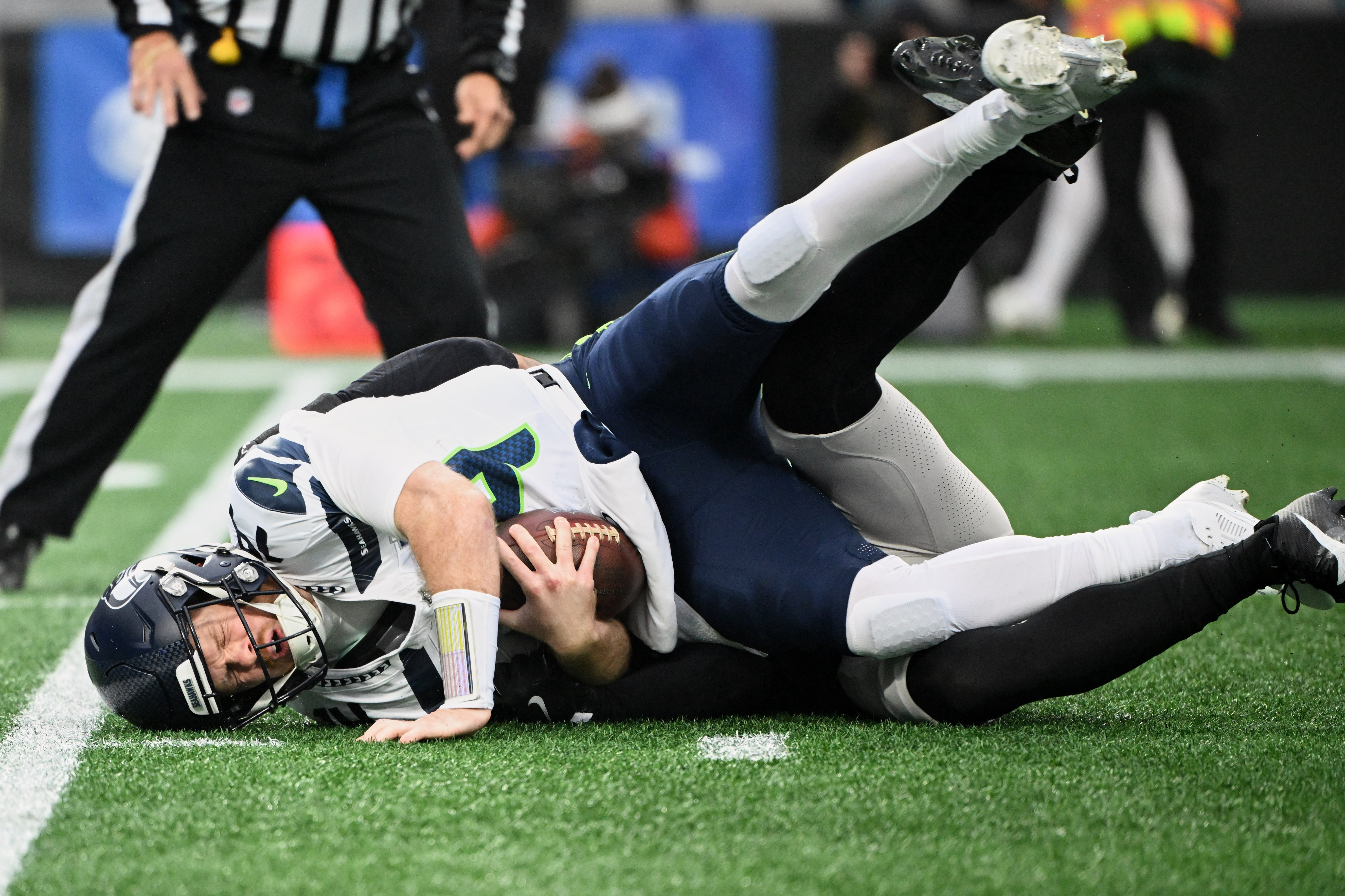 Seattle Seahawks quarterback Sam Darnold (14) is sacked as we rank the worst Super Bowl QBs this century.