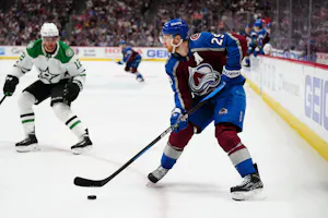 Colorado Avalanche center Nathan MacKinnon controls the puck in overtime against the Dallas Stars as we dive into our 2024-25 NHL award predictions for the Hart, Vezina, and Norris Trophies. 