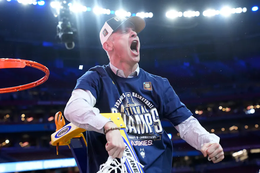 UConn Huskies head coach Dan Hurley cuts down the net after defeating the Purdue Boilermakers in the national championship game of the 2024 NCAA Tournament. UConn are the favorites by the 2025 March Madness Odds. 