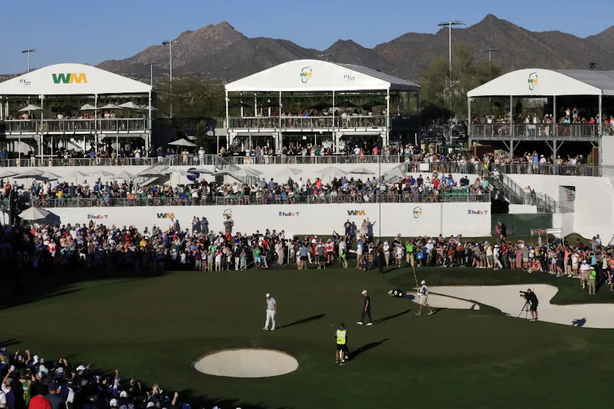 Scottie Scheffler reacts after a birdie on the third playoff hole to win the WM Phoenix Open at TPC Scottsdale on February 13, 2022 in Scottsdale, Arizona. Photo by Christian Petersen Getty Images via AFP.