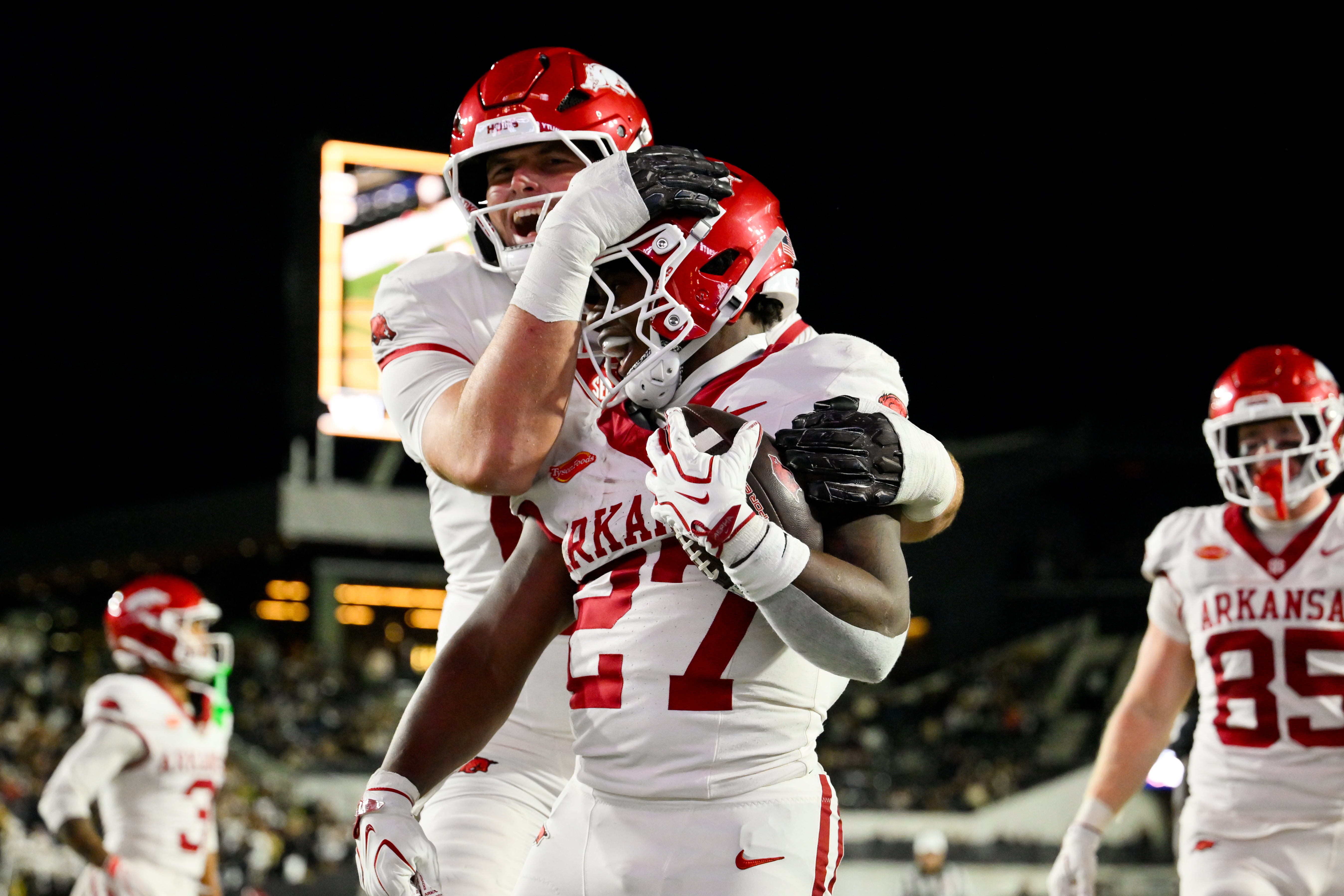 Arkansas Razorbacks running back Cam Settlees celebrates a touchdown as we make our best ATS predictions for Week 9 of college football. 