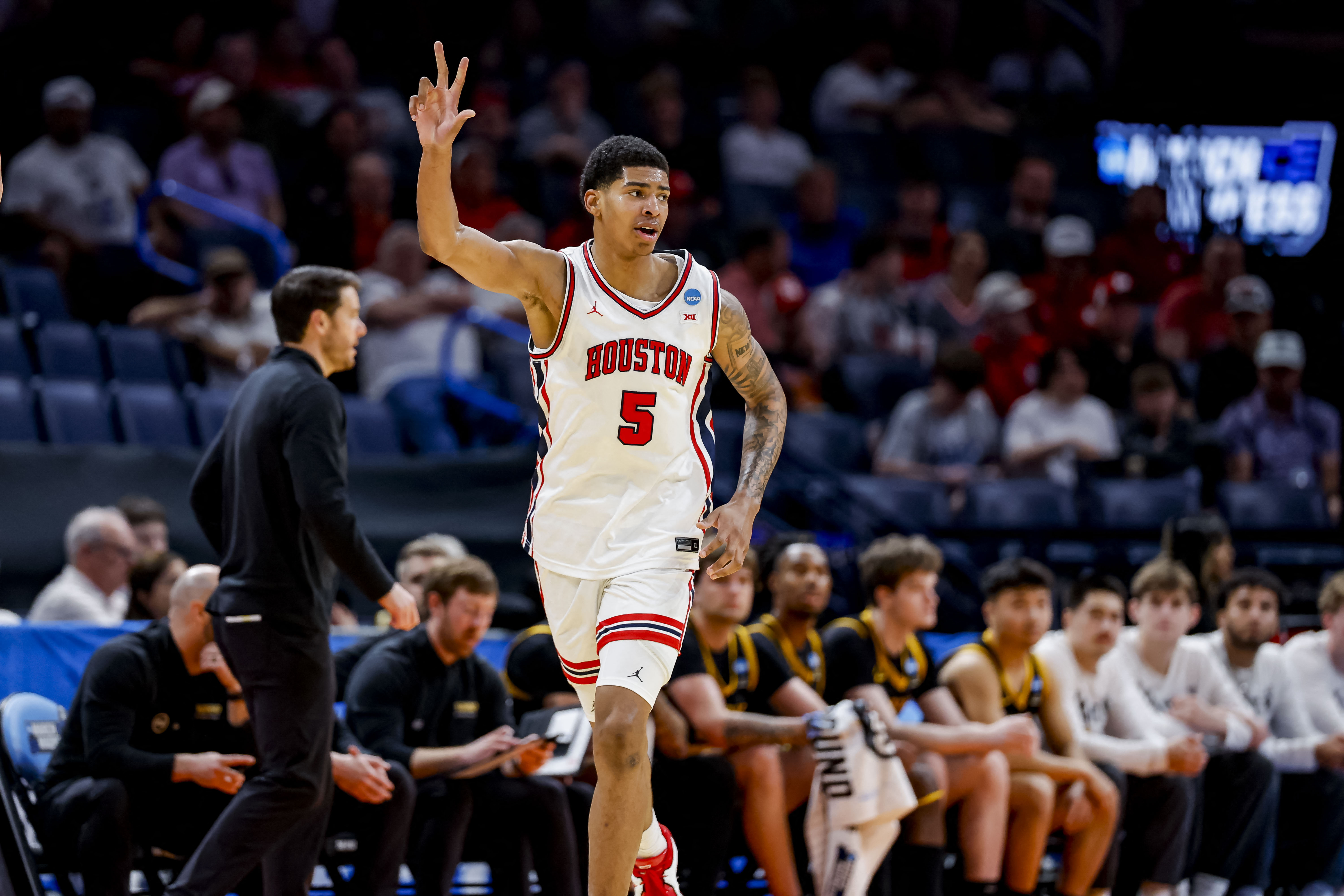 Houston's Chris Cenac Jr. leads the Cougars in one of four games covered in our March Madness predictions for Thursday. 