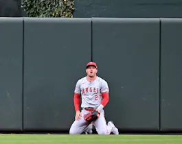 Mike Trout of the Los Angeles Angels reacts after a home run by Cedric Mullins of the Baltimore Orioles, and we examine whether it's time to stop betting on Mike Trout to win AL MVP with a look at the best MLB odds.,