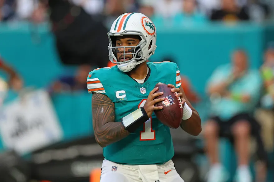 Tua Tagovailoa of the Miami Dolphins drops back to pass as we look at the top Bills vs. Dolphins bonus code.