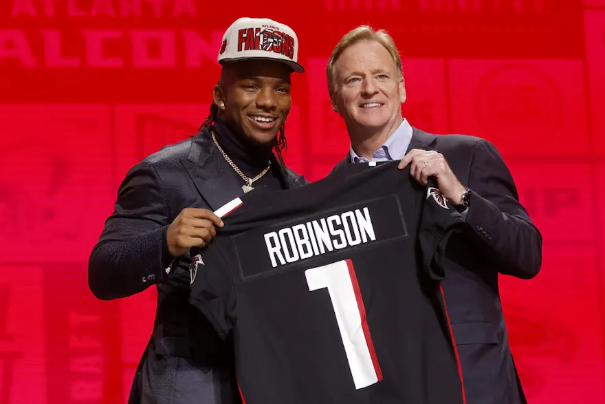 Bijan Robinson poses with NFL Commissioner Roger Goodell as we look at the Offensive Rookie of the Year odds
