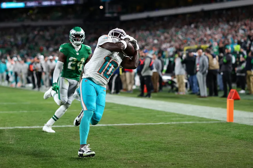 Tyreek Hill #10 of the Miami Dolphins catches a touchdown as we look at our Dolphins vs. Chiefs prediction