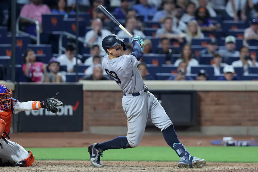 New York Yankees center fielder Aaron Judge follows through on a grand slam home run during the eighth inning against the New York Mets at Citi Field. We're backing Judge in our MLB Player Props.