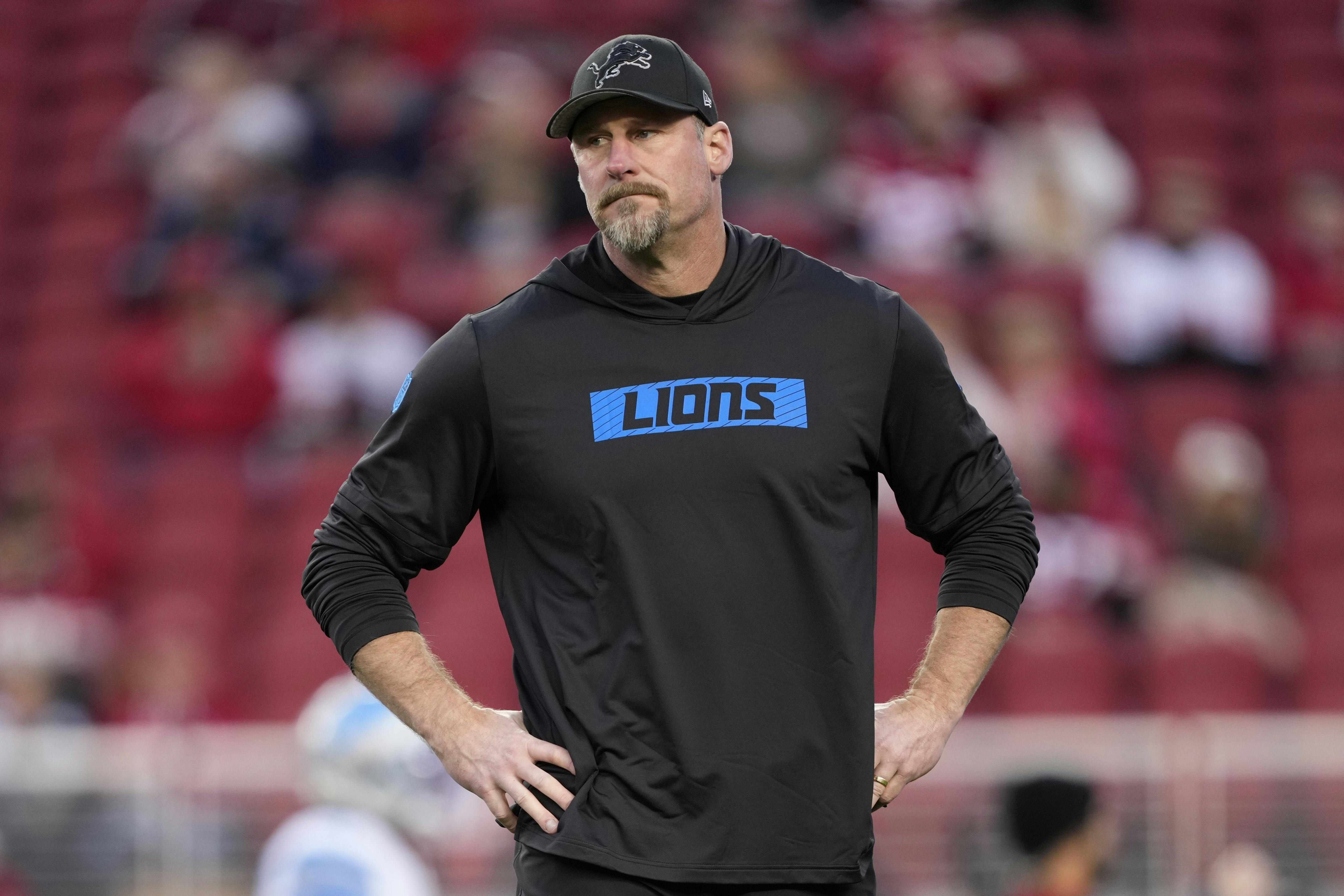 Detroit Lions head coach Dan Campbell watches warmups as we examine the NFL Coach of the Year odds entering Week 18.