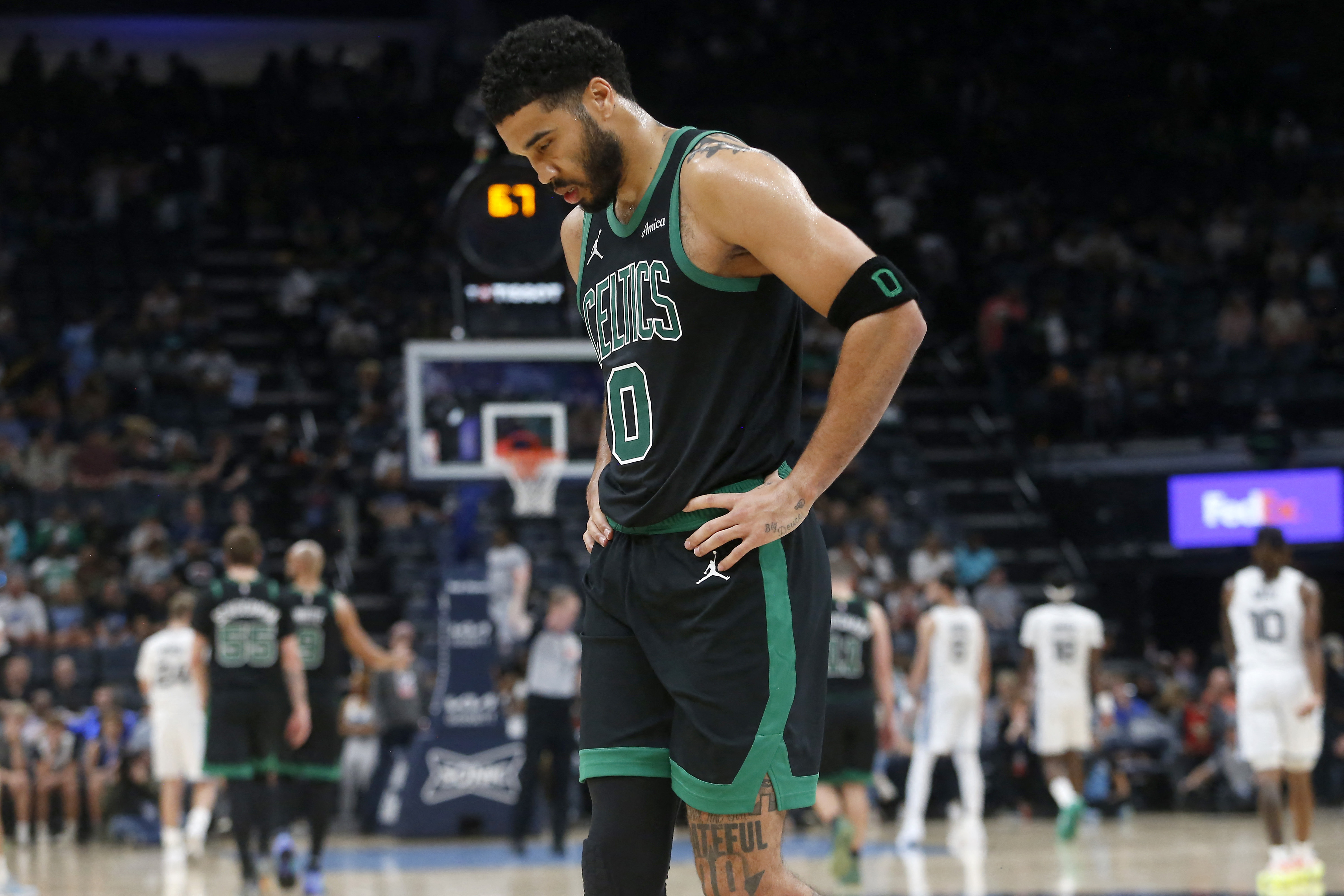 Boston Celtics forward Jayson Tatum - who's featured in my Timberwolves vs. Celtics player props - walks toward the bench.