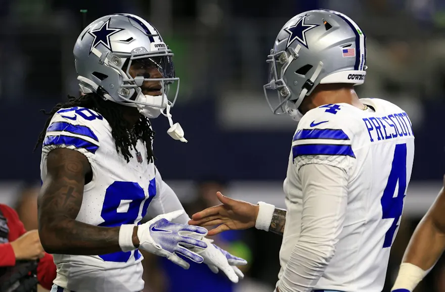 Wide receiver CeeDee Lamb #88 of the Dallas Cowboys is congratulated by quarterback Dak Prescott #4 after catching a pass in the end zone for a touchdown as we make our Lions vs. Cowboys NFL player props picks and predictions for Saturday.