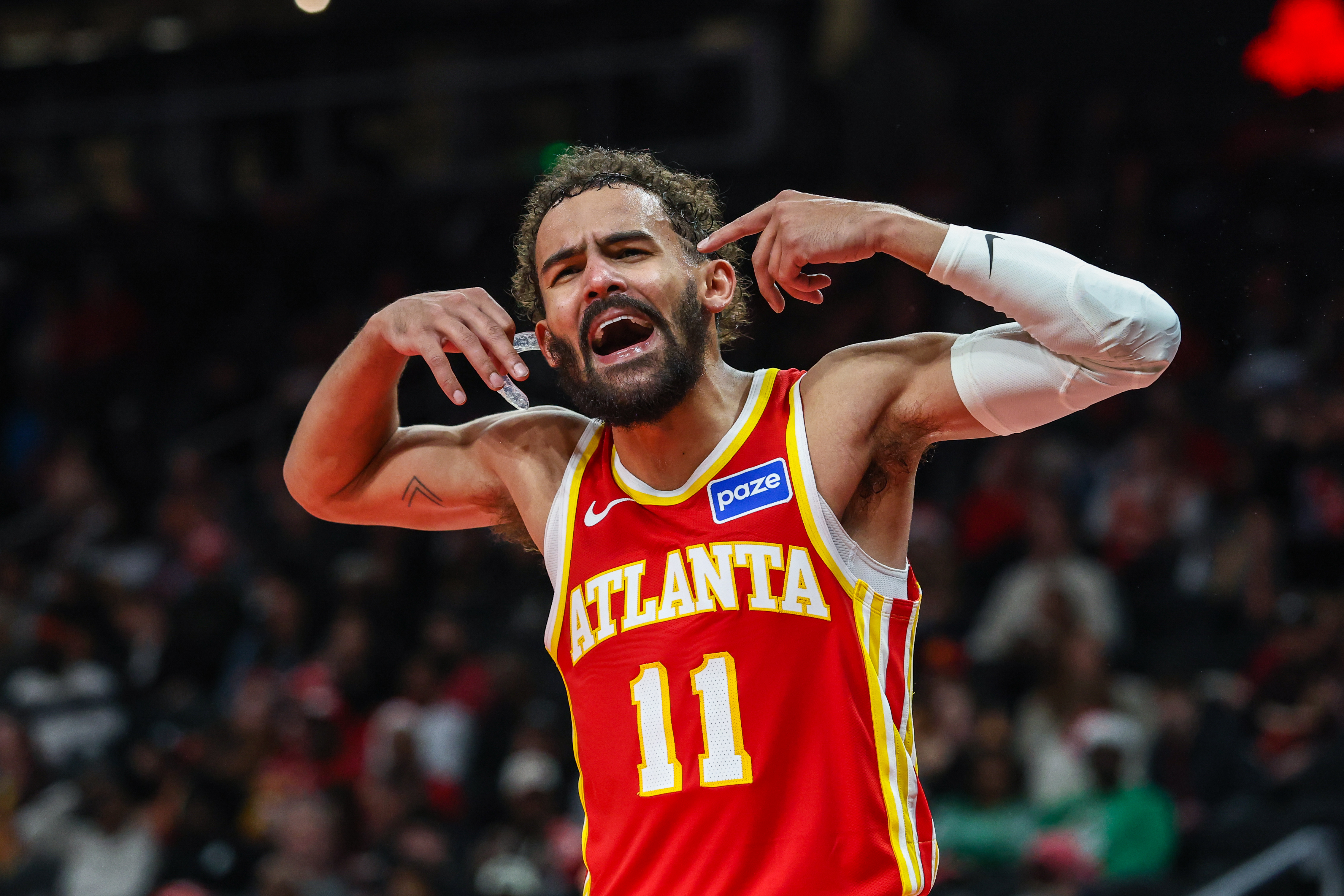 Atlanta Hawks guard Trae Young (11) yells as he is featured in our Knicks vs. Hawks player props.