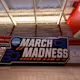 A view of the March Madness logo inside the Grand Hall at Reynolds Coliseum as we look at the best Sweet 16 odds boosts and betting promos