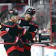 Jaccob Slavin and Jack Drury celebrate after a win against the New York Islanders in Game 5 as we make our expert predictions for Game 1 of the Carolina Hurricanes vs. New York Rangers second-round series. 