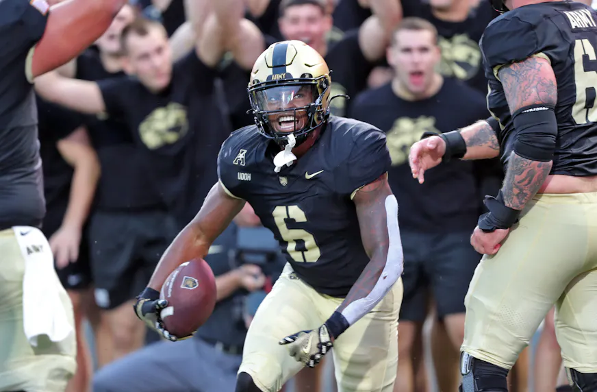 Army running back Kanye Udoh celebrates his touchdown against Lehigh. We're backing Udoh in our Army vs. Temple Prediction.