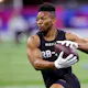 Bijan Robinson of Texas participates in a drill during as we look at the NFL draft odds.