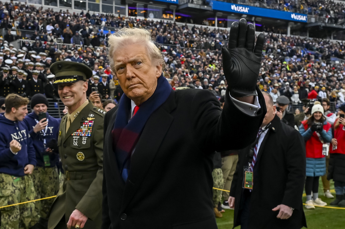 Donald J. Trump, President of the United States of America, waves while leaving a field, and we're looking at whether Donald Trump will invade Greenland.