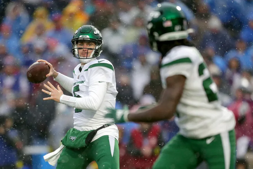 Mike White throws a pass to Zonovan Knight #27 of the New York Jets in the third quarter of a game against the Buffalo Bills at Highmark Stadium on December 11, 2022 in Orchard Park, New York.
