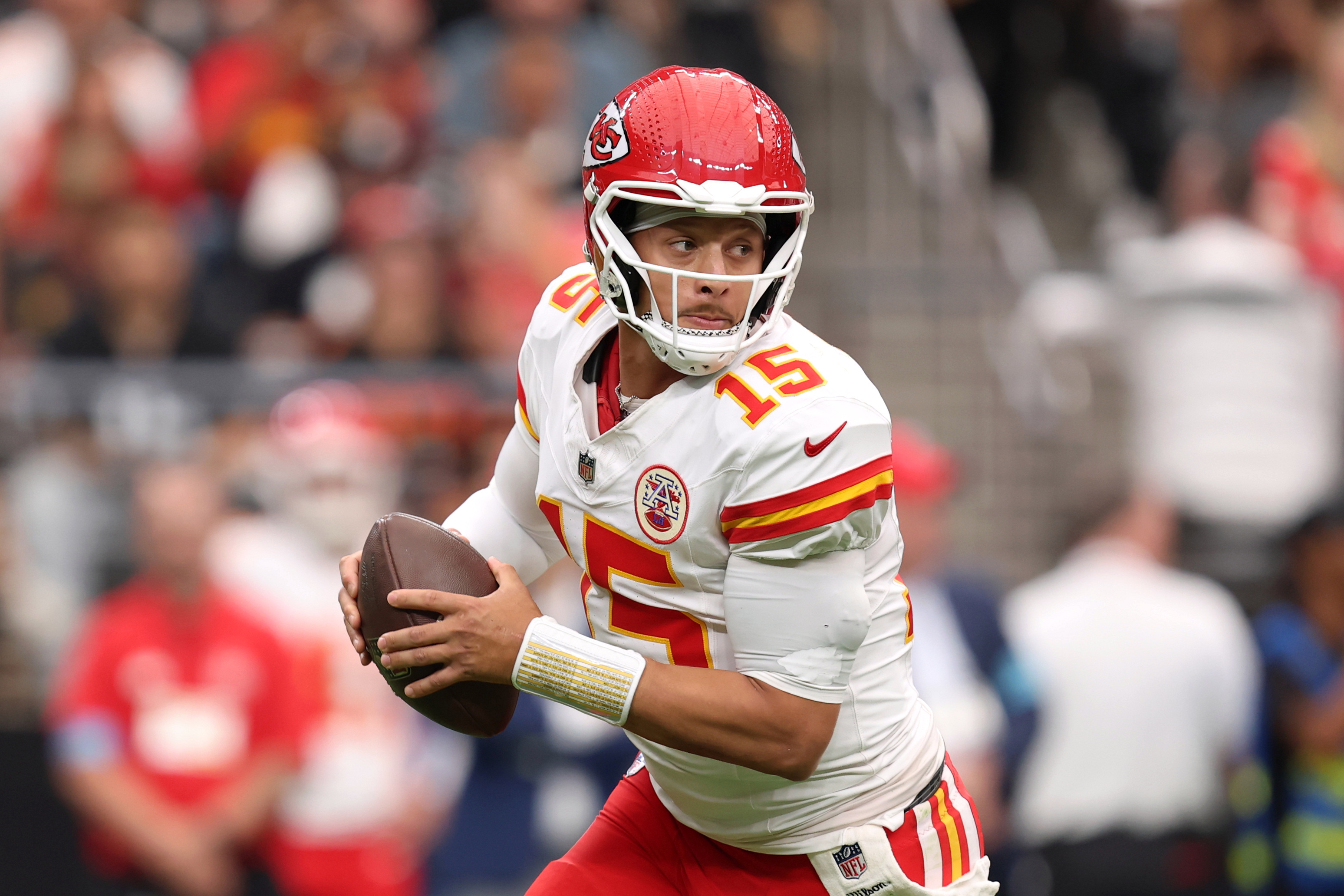 Kansas City Chiefs quarterback Patrick Mahomes (15) scrambles as we provide our NFL player props for Week 8.