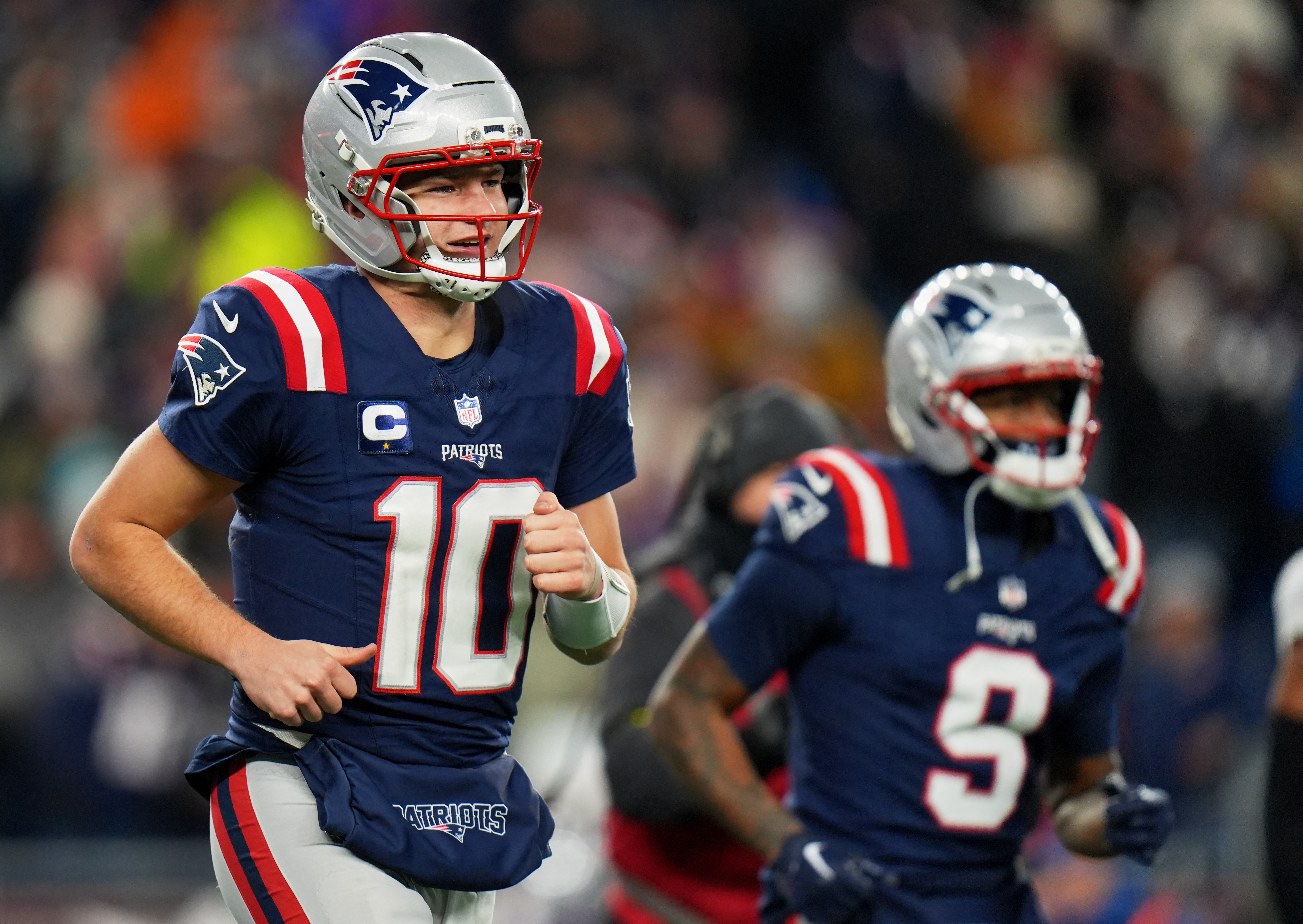 New England Patriots quarterback Drake Maye (10) and wide receiver Kayshon Boutte (9) run as we break down our Chargers vs. Patriots prediction.