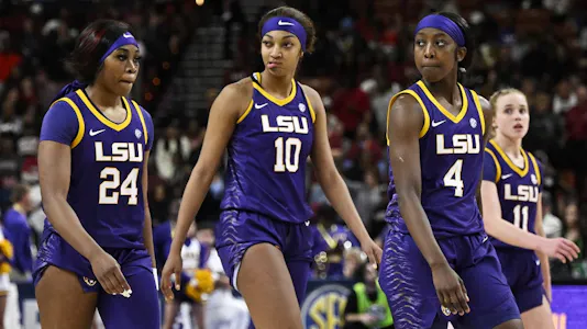 Aneesah Morrow #24, Angel Reese #10, Flau'jae Johnson #4, and Hailey Van Lith #11 of the LSU Lady Tigers stand on the court as we offer our LSU vs. UCLA prediction and pick for the Sweet 16 of the women's NCAA Tournament on Saturday.